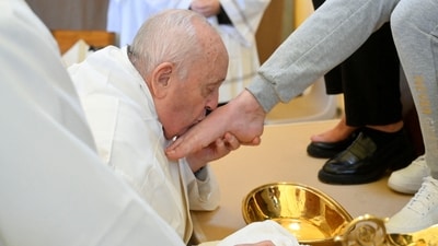Pope Francis kisses the feet of an inmate of the female section of Rebibbia Prison during a Holy Thursday ritual, in Rome, Italy. (via REUTERS)