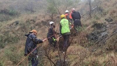 Rescuers retrieving bodies from the accident site near Battery Chashma in Ramban district on the Jammu-Srinagar national highway on Friday. (HT Photo)