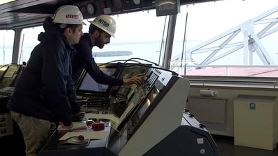 This handout screegrab courtesy of the National Transportation Safety Board, shows investigators aboard the cargo ship Dali downloading the vessel voyage data recorder as part of the steel frame of the Francis Scott Key Bridge is seen outside in Baltimore, Maryland on March 28, 2024. (AFP) This handout screegrab courtesy of the National Transportation Safety Board, shows investigators aboard the cargo ship Dali downloading the vessel voyage data recorder as part of the steel frame of the Francis Scott Key Bridge is seen outside in Baltimore, Maryland on March 28, 2024. (AFP)