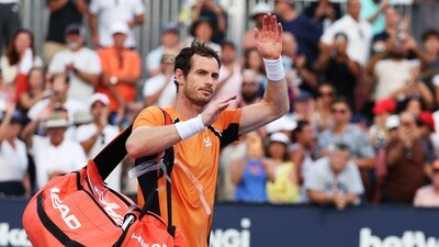 Andy Murray of Great Britain waves to the crowd after losing in three sets against Tomas Machac of the Czech Republic on Day 9 of the Miami Open (Getty Images via AFP)