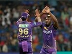 Andre Russell, right, celebrates with captain Shreyas Iyer after the dismissal of Cameron Green