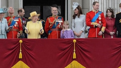 Queen Elizabeth II gestures as she stands with other members of the Royal Family on Buckingham Palace balcony following the Queen's Birthday Parade, 'Trooping the Colour' at Horse Guards Parade in London. The ceremony of Trooping the Colour is believed to have first been performed during the reign of King Charles II. In 1748, it was decided that the parade would be used to mark the official birthday of the Sovereign. AFP/Leon Neal Queen Elizabeth II gestures as she stands with other members of the Royal Family on Buckingham Palace balcony following the Queen's Birthday Parade, 'Trooping the Colour' at Horse Guards Parade in London. The ceremony of Trooping the Colour is believed to have first been performed during the reign of King Charles II. In 1748, it was decided that the parade would be used to mark the official birthday of the Sovereign. AFP/Leon Neal