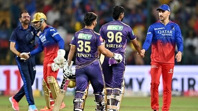 Kolkata Knight Riders' captain Shreyas Iyer (2R) is congratulated by his Royal Challengers Bengaluru's counterpart Faf du Plessis (R) after their win. (AFP) Kolkata Knight Riders' captain Shreyas Iyer (2R) is congratulated by his Royal Challengers Bengaluru's counterpart Faf du Plessis (R) after their win. (AFP)