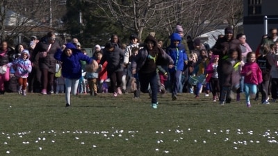 In this photo, children run to pick up thousands of marshmallows dropped at a park. (AP)