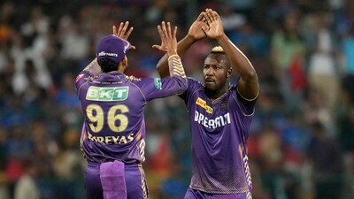 Andre Russell, right, celebrates with captain Shreyas Iyer after the dismissal of Cameron Green (AP)