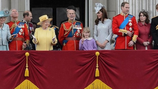 Queen Elizabeth II gestures as she stands with other members of the Royal Family on Buckingham Palace balcony following the Queen's Birthday Parade, 'Trooping the Colour' at Horse Guards Parade in London. The ceremony of Trooping the Colour is believed to have first been performed during the reign of King Charles II. In 1748, it was decided that the parade would be used to mark the official birthday of the Sovereign. AFP/Leon Neal