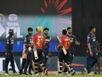 Lucknow Super Giants' and Punjab Kings' players exchange handshakes after their match. Lucknow Super Giants' and Punjab Kings' players exchange handshakes after their match.