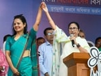 West Bengal CM and TMC chief Mamata Banerjee with party candidate Mahua Moitra at an election rally ahead of Lok Sabha polls at Dhubuliya in Nadia, on March 31.(PTI)