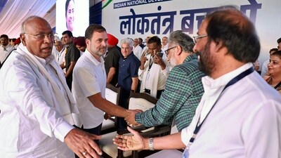 Congress President Mallikarjun Kharge and party leader Rahul Gandhi meet DMK MP Tiruchi N. Siva and others during the INDIA alliance rally at Ramlila Maidan in New Delhi on Sunday. (ANI Photo) Congress President Mallikarjun Kharge and party leader Rahul Gandhi meet DMK MP Tiruchi N. Siva and others during the INDIA alliance rally at Ramlila Maidan in New Delhi on Sunday. (ANI Photo)