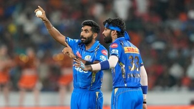 Mumbai Indians' Jasprit Bumrah, left, talks captain Hardik Pandya before bowling a delivery (AP) Mumbai Indians' Jasprit Bumrah, left, talks captain Hardik Pandya before bowling a delivery (AP)