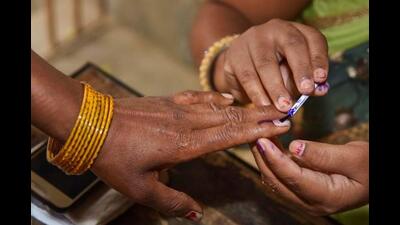 Jamui: An election officer puts an indelible ink mark on the finger of a voter after she cast her vote during the first phase of the general elections, at a polling station in Jamui disrtict, Thursday, April 11, 2019. (PTI Photo)(PTI4_11_2019_000078B) (PTI)