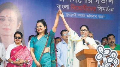 West Bengal chief minister Mamata Banerjee with Trinamool Congress candidate Mahua Moitra at an election rally at Dhubuliya, in Nadia, on Sunday. (PTI)