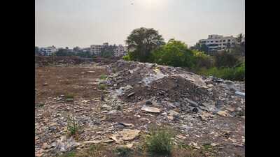 he Pimpri-Chinchwad police booked four people for dumping construction debris on the bank of the Pavana river. (HT PHOTO) he Pimpri-Chinchwad police booked four people for dumping construction debris on the bank of the Pavana river. (HT PHOTO)