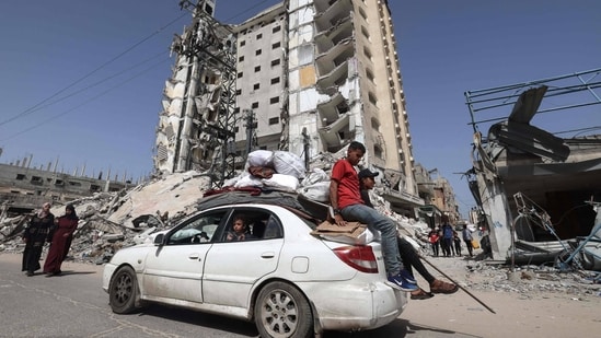 Members of a Palestinian family leave Rafah in the southern Gaza Strip with personal belongings on March 31, 2024, amid the ongoing conflict between Israel and the militant group Hamas. (AFP)