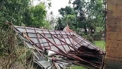 A house gets destroyed by the cyclonic storm, in Agartala on Monday (ANI)
