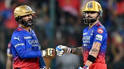Royal Challengers Bengaluru's Virat Kohli (R) and Dinesh Karthik bump their fists. (AFP) Royal Challengers Bengaluru's Virat Kohli (R) and Dinesh Karthik bump their fists. (AFP)