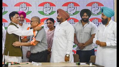 Dr Dharamvira Gandhi, 72, a former Aam Aadmi Party (AAP) MP from Patiala, joined the Congress in the presence of senior party leaders in New Delhi on Monday. (PTI)