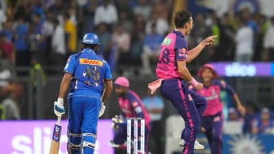 Rajasthan Royals' Trent Boult celebrates the dismissal of Mumbai Indians' Rohit Sharma (AP) Rajasthan Royals' Trent Boult celebrates the dismissal of Mumbai Indians' Rohit Sharma (AP)