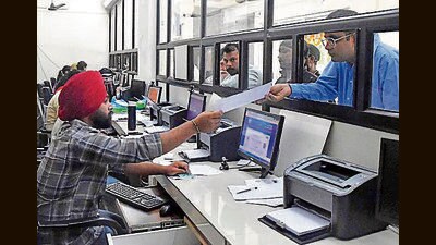 Residents submitting their property tax at the Sewa Kendra at MC Zone D office in Ludhiana. (Manish/HT) Residents submitting their property tax at the Sewa Kendra at MC Zone D office in Ludhiana. (Manish/HT)