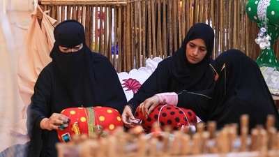 Emirati women weave thread in the Al Talli method, a traditional local weaving technique, during an annual heritage festival in Al-Ain. (AFP) Emirati women weave thread in the Al Talli method, a traditional local weaving technique, during an annual heritage festival in Al-Ain. (AFP)
