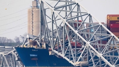 Eight people were on the bridge during the collapse, with two individuals rescued soon after the collapse. Divers recovered the bodies of two others and the other four are presumed dead. (Getty Images via AFP) Eight people were on the bridge during the collapse, with two individuals rescued soon after the collapse. Divers recovered the bodies of two others and the other four are presumed dead. (Getty Images via AFP)