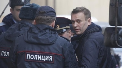 Russian opposition leader Alexei Navalny is escorted upon his arrival for a hearing in Moscow after being detained at a protest against corruption and demanding the resignation of Prime Minister Dmitry Medvedev. (Reuters) Russian opposition leader Alexei Navalny is escorted upon his arrival for a hearing in Moscow after being detained at a protest against corruption and demanding the resignation of Prime Minister Dmitry Medvedev. (Reuters)