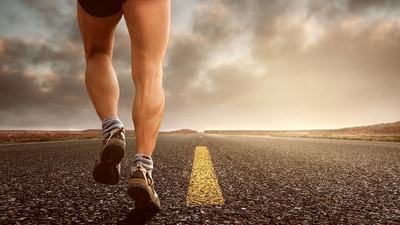 When an amateur runner takes longer strides, their heels strike the ground, landing ahead of their knees. The heavy impact from the contact with the ground transmits excessive force up the shin, to the knee, the hips and up the spine, leading to a majority of aches and pains in these regions. When an amateur runner takes longer strides, their heels strike the ground, landing ahead of their knees. The heavy impact from the contact with the ground transmits excessive force up the shin, to the knee, the hips and up the spine, leading to a majority of aches and pains in these regions.