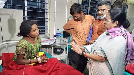 West Bengal Chief Minister Mamata Banerjee meets a cyclone-affected person at the Jalpaiguri Super Specialty Hospital, on Sunday. (ANI)