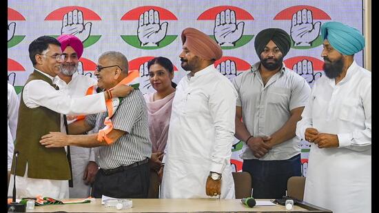 Dr Dharamvira Gandhi, 72, a former Aam Aadmi Party (AAP) MP from Patiala, joined the Congress in the presence of senior party leaders in New Delhi on Monday. (PTI)