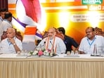Union Home Minister Amit Shah with BJP leader B.S. Yediyurappa and Janata Dal (Secular) leader HD Kumaraswamy during a meeting ahead of Lok Sabha elections, in Bengaluru.