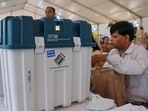 Polling officials collect VVPATs and other voting materials. Polling officials collect VVPATs and other voting materials.