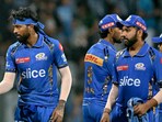 MI captain Hardik Pandya shakes hands with RR's Riyan Parag as Rohit Sharma waits for his turn