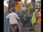 Snapshot of the elderly man distributing water. Snapshot of the elderly man distributing water.