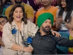 Archana Puran Singh sits in Kapil's lap.