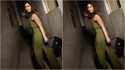 In terms of accessories, she styled her look with a pair of white sneaker shoes, a black handbag and a pair of golden square-shaped dangling earrings that added a touch of glam vibes to her sporty look. (Instagram/@kareenakapoorkhan) In terms of accessories, she styled her look with a pair of white sneaker shoes, a black handbag and a pair of golden square-shaped dangling earrings that added a touch of glam vibes to her sporty look. (Instagram/@kareenakapoorkhan)