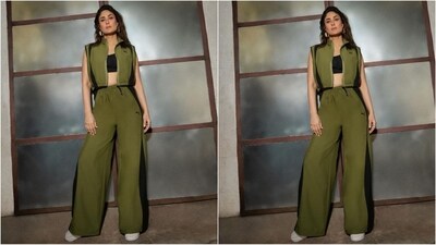 In another look, she wore an olive green co-ord set featuring a pair of flared trousers with a black stripe along the side. She teamed it with a matching open cropped jacket with chain detailing and a collar neckline. Inside she wore a black sports bra to complete the look. (Instagram/@kareenakapoorkhan) In another look, she wore an olive green co-ord set featuring a pair of flared trousers with a black stripe along the side. She teamed it with a matching open cropped jacket with chain detailing and a collar neckline. Inside she wore a black sports bra to complete the look. (Instagram/@kareenakapoorkhan)