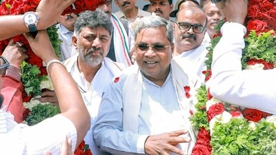 Karnataka Chief Minister Siddaramaiah with State Deputy Chief Minister DK Shivakumar being garlanded in Bengaluru. (ANI Photo) (CM of Karnataka X) Karnataka Chief Minister Siddaramaiah with State Deputy Chief Minister DK Shivakumar being garlanded in Bengaluru. (ANI Photo) (CM of Karnataka X)