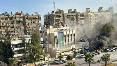 Dense smoke billows out after the Consular Section of Iranian Embassy in the Syrian capital of Damascus is destroyed by Israeli airstrikes, in Damascus on Tuesday. Reportedly at least eight people killed and several others injured. (ANI Photo) (IRNA News Agency) Dense smoke billows out after the Consular Section of Iranian Embassy in the Syrian capital of Damascus is destroyed by Israeli airstrikes, in Damascus on Tuesday. Reportedly at least eight people killed and several others injured. (ANI Photo) (IRNA News Agency)