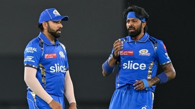 Mumbai Indians' captain Hardik Pandya and his teammate Rohit Sharma (L) gesture during the Indian Premier League (IPL) Twenty20 cricket match (AFP)