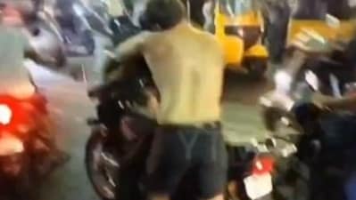 In a horrible incident, a drunk and shirtless foreigner attempted to bite a man who was riding his bike in Chennai. (X(formerly Twitter)) In a horrible incident, a drunk and shirtless foreigner attempted to bite a man who was riding his bike in Chennai. (X(formerly Twitter))