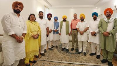 Chief minister Bhagwant Mann (centre) with the Aam Aadmi Party’s Patiala Lok Sabha candidate Dr Balbir Sidhu (fourth from right) and party MLAs from the parliamentary constituency after a meeting in Chandigarh on Tuesday. (HT Photo)