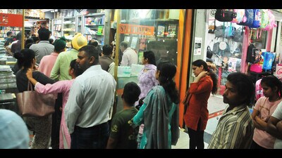 Parents queued up outside a bookshop in Sector 19, Chandigarh, on Tuesday. (HT Photo) Parents queued up outside a bookshop in Sector 19, Chandigarh, on Tuesday. (HT Photo)