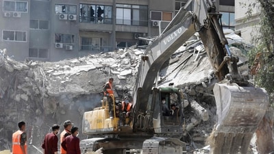 Rescue workers search in the rubble of a building annexed to the Iranian embassy a day after an air strike in Damascus. (AFP) Rescue workers search in the rubble of a building annexed to the Iranian embassy a day after an air strike in Damascus. (AFP)