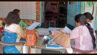 School teachers compiling data in Ludhiana on Tuesday. (Manish/HT)
