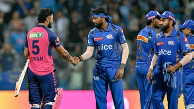 MI captain Hardik Pandya shakes hands with RR's Riyan Parag as Rohit Sharma waits for his turn (AFP) MI captain Hardik Pandya shakes hands with RR's Riyan Parag as Rohit Sharma waits for his turn (AFP)