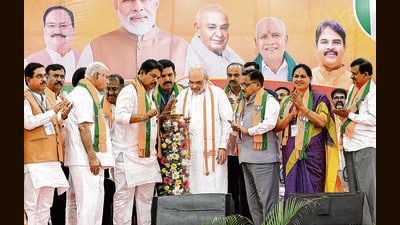 Union home minister Amit Shah with BJP senior leader B S Yeddyurappa, party state president B Y Vijayendra, opposition leader R Ashok and others during the party's Karnataka Shakti Kendra Pramukh meeting, at Palace Ground in Bengaluru on Tuesday. (ANI) Union home minister Amit Shah with BJP senior leader B S Yeddyurappa, party state president B Y Vijayendra, opposition leader R Ashok and others during the party's Karnataka Shakti Kendra Pramukh meeting, at Palace Ground in Bengaluru on Tuesday. (ANI)