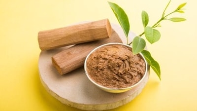 Sandalwood paste: Make a paste of sandalwood powder with water and apply it to the forehead. Sandalwood's cooling properties can help lower body temperature and provide relief from fever. (Shutterstock) Sandalwood paste: Make a paste of sandalwood powder with water and apply it to the forehead. Sandalwood's cooling properties can help lower body temperature and provide relief from fever. (Shutterstock)