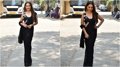 Madhuri Dixit, on the other hand, looked dazzling in her ethnic avatar to shoot for an episode of the reality TV show Dance Deewane. She wore a black sequin saree. It featured tassels on the pallu and shimmering black sequin embellishments on the broad borders and in floral patterns. (HT Photo/Varinder Chawla) Madhuri Dixit, on the other hand, looked dazzling in her ethnic avatar to shoot for an episode of the reality TV show Dance Deewane. She wore a black sequin saree. It featured tassels on the pallu and shimmering black sequin embellishments on the broad borders and in floral patterns. (HT Photo/Varinder Chawla)
