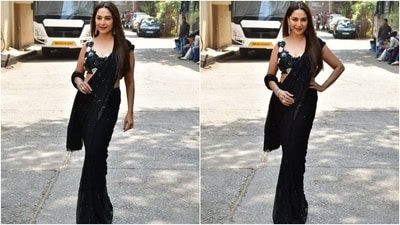 Madhuri wore the six yards traditionally, pleating the pallu on her shoulders. She paired the saree with a matching blouse featuring a plunging neckline, floral applique work adorned in white and black embellishments, a cropped midriff-baring hem, and a fitted design. (HT Photo/Varinder Chawla) Madhuri wore the six yards traditionally, pleating the pallu on her shoulders. She paired the saree with a matching blouse featuring a plunging neckline, floral applique work adorned in white and black embellishments, a cropped midriff-baring hem, and a fitted design. (HT Photo/Varinder Chawla)