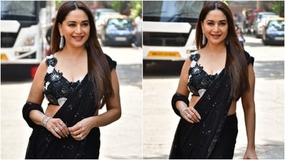 Lastly, Madhuri accessorised the ensemble with silver dangling earrings, matching bracelets, and embellished rings. Silver-painted nails, darkened brows, winged eyeliner, mascara on the lashes, brick red lip shade, blush on the cheeks, and beaming highlighter rounded off the glam picks. (HT Photo/Varinder Chawla) Lastly, Madhuri accessorised the ensemble with silver dangling earrings, matching bracelets, and embellished rings. Silver-painted nails, darkened brows, winged eyeliner, mascara on the lashes, brick red lip shade, blush on the cheeks, and beaming highlighter rounded off the glam picks. (HT Photo/Varinder Chawla)
